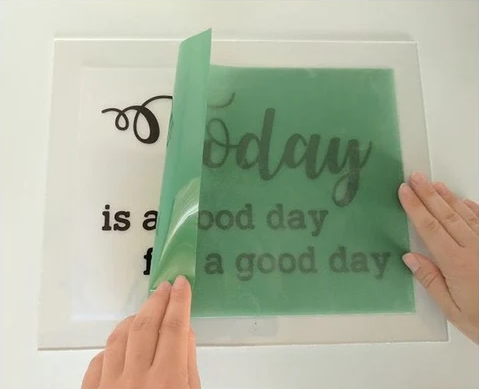 DIY screen printing stencil being placed on transparency film