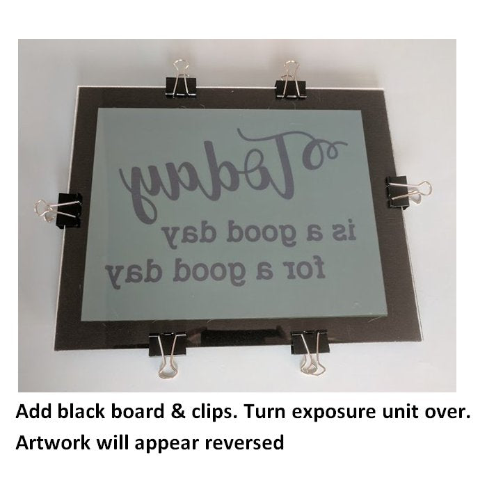 Add black board and secure exposure unit with clips