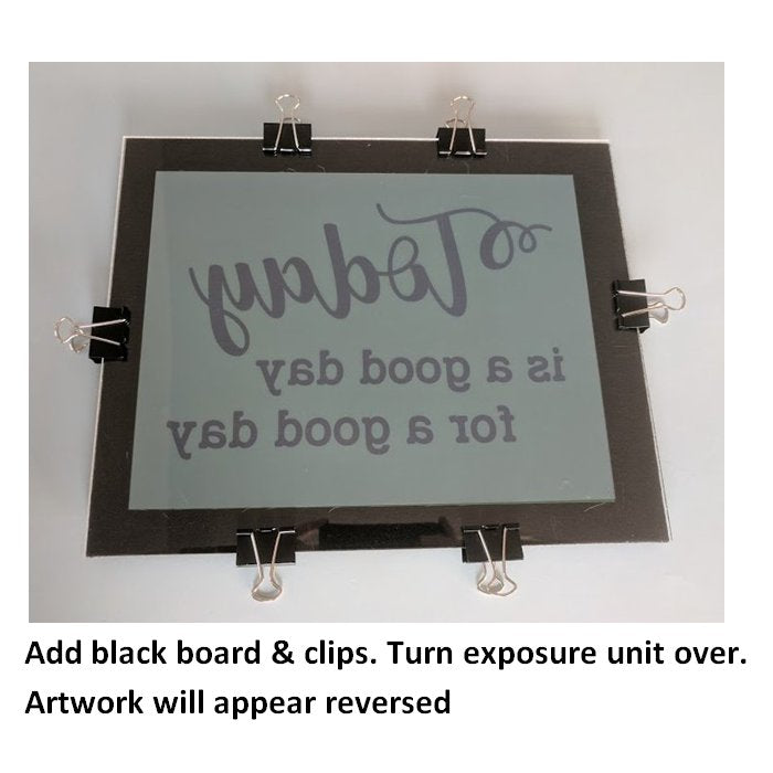 Add black board and secure exposure unit with clips from the screen printing kit